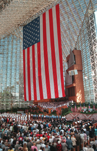 A huge 10-story high flag hangs from the rafters of the famed  Crystal Cathedral on Sunday, May 26, 1996 in Garden Grove, Calif.  The towering ensign was unfurled during an early morning service as part of the Memorial Day activities. (AP Photo/Bob Riha Jr.)